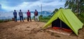 Munnar , India - NovemberÃ¢â¬Å½ Ã¢â¬Å½30Ã¢â¬Å½th Ã¢â¬Å½2019 : Four Friends hikers standing on top of the mountain near tent camping